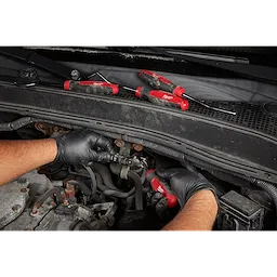 Worker using the Hook and Pick hand tool