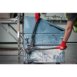 Person using 30" Bolt Cutter with red handles and black blades to cut a thick metal chain securing a blue container.