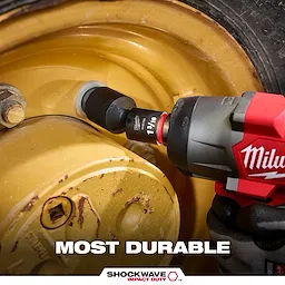 Power tool tightening a large wheel lug using a 6PC SHOCKWAVE Impact Duty 1/4" Drive SAE Standard Swivel Socket Set.