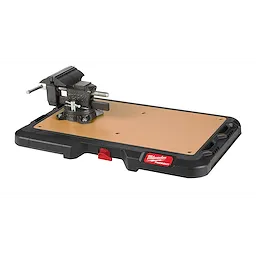 PACKOUT Customizable Work Top with a black and reddish design, featuring a mounted vise on a wooden work surface.