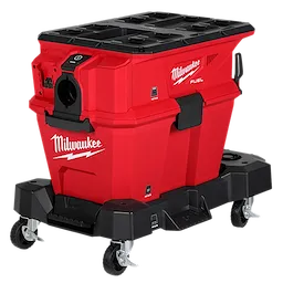 This image shows the Milwaukee Fuel Packout Vacuum Cleaner. It is a red and black, durable cleaning tool mounted on wheels for easy mobility. The vacuum has the Milwaukee logo with a lightning bolt and features multiple compartments and attachment points on the top and front.
