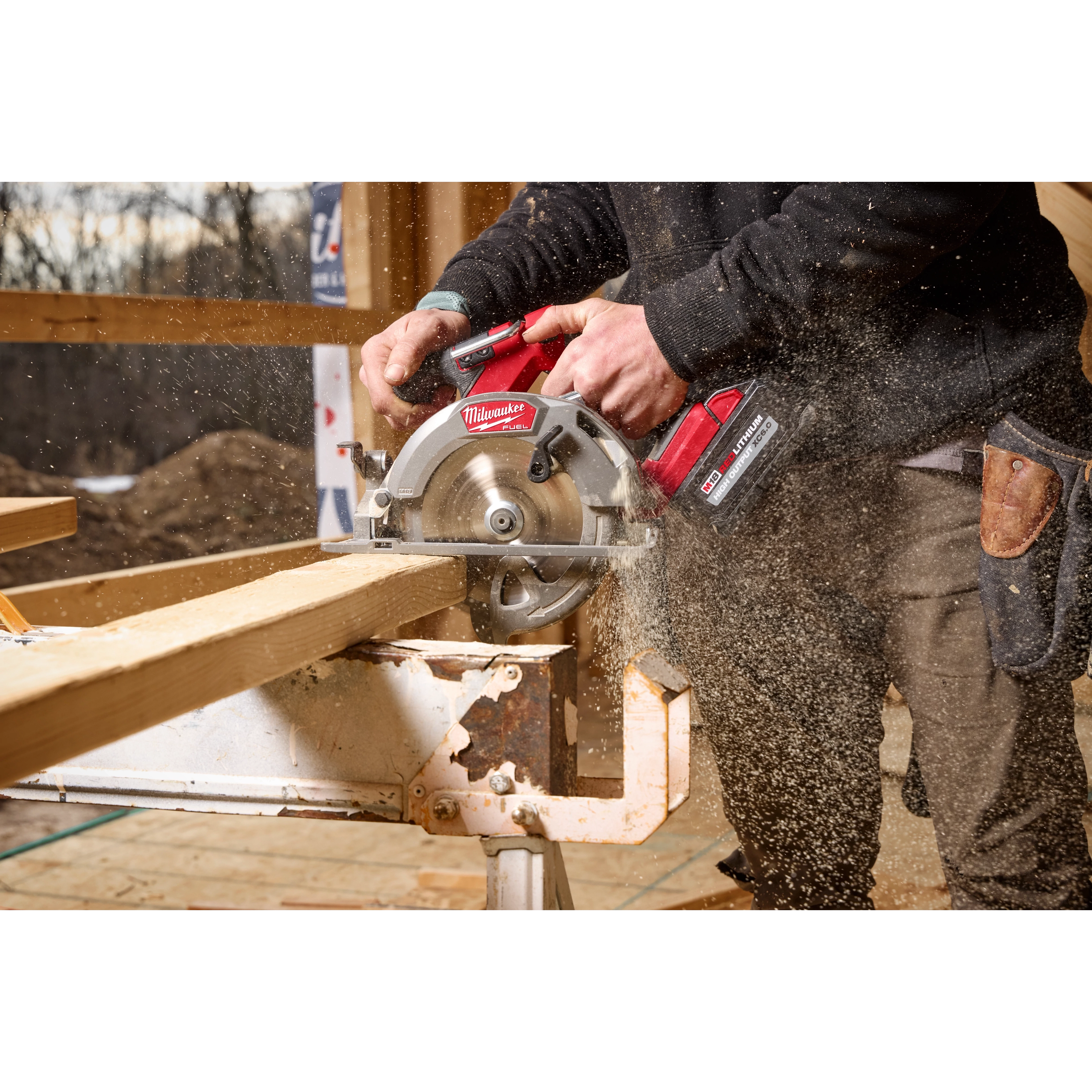 Image of a worker using the Milwaukee M18 FUEL 6-1/2" Circular Saw on a jobsite to cut wood