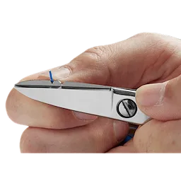 Close-up of a hand holding Electrician Scissors, cutting a small blue wire. The scissors have a built-in wire stripping notch.