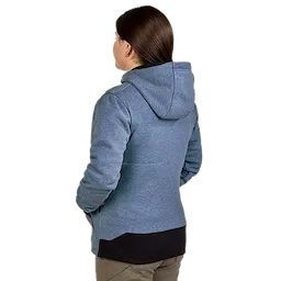 A woman is wearing a gray M12™ Women's Heated Hoodie with a hood. The jacket features a black section on the bottom hem and is worn with khaki pants.