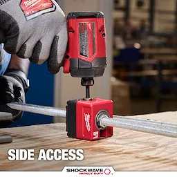 SHOCKWAVE Impact Duty 1/2" Threaded Rod Nut Runner clamped on a threaded rod on a workbench in a workshop.