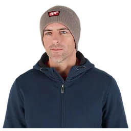 Image of a man wearing the Milwaukee Rib-Knit Cuffed Beanie in brown