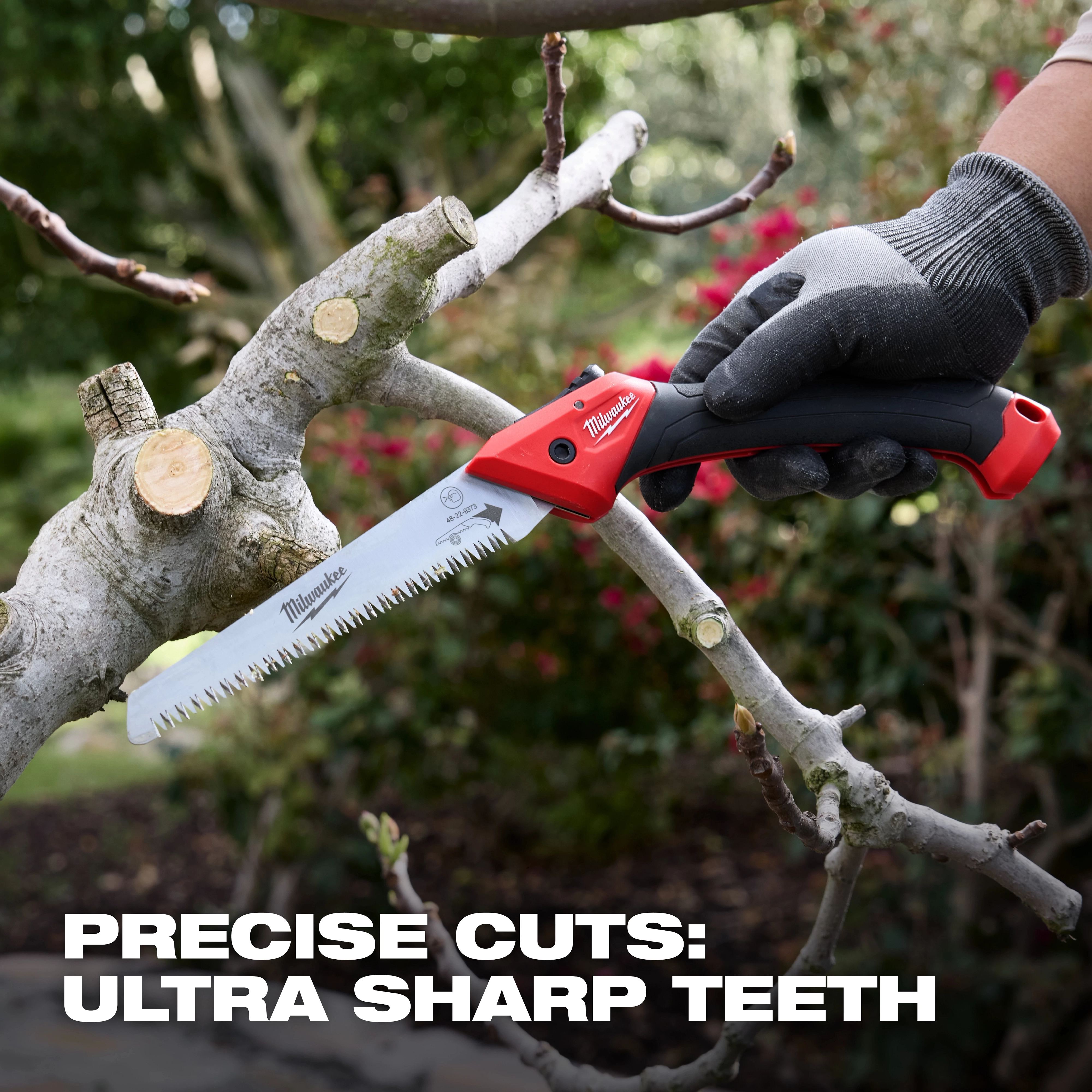 7” Folding Pruning Saw – Straight Blade cutting a tree branch outdoors with gloved hand holding the handle.