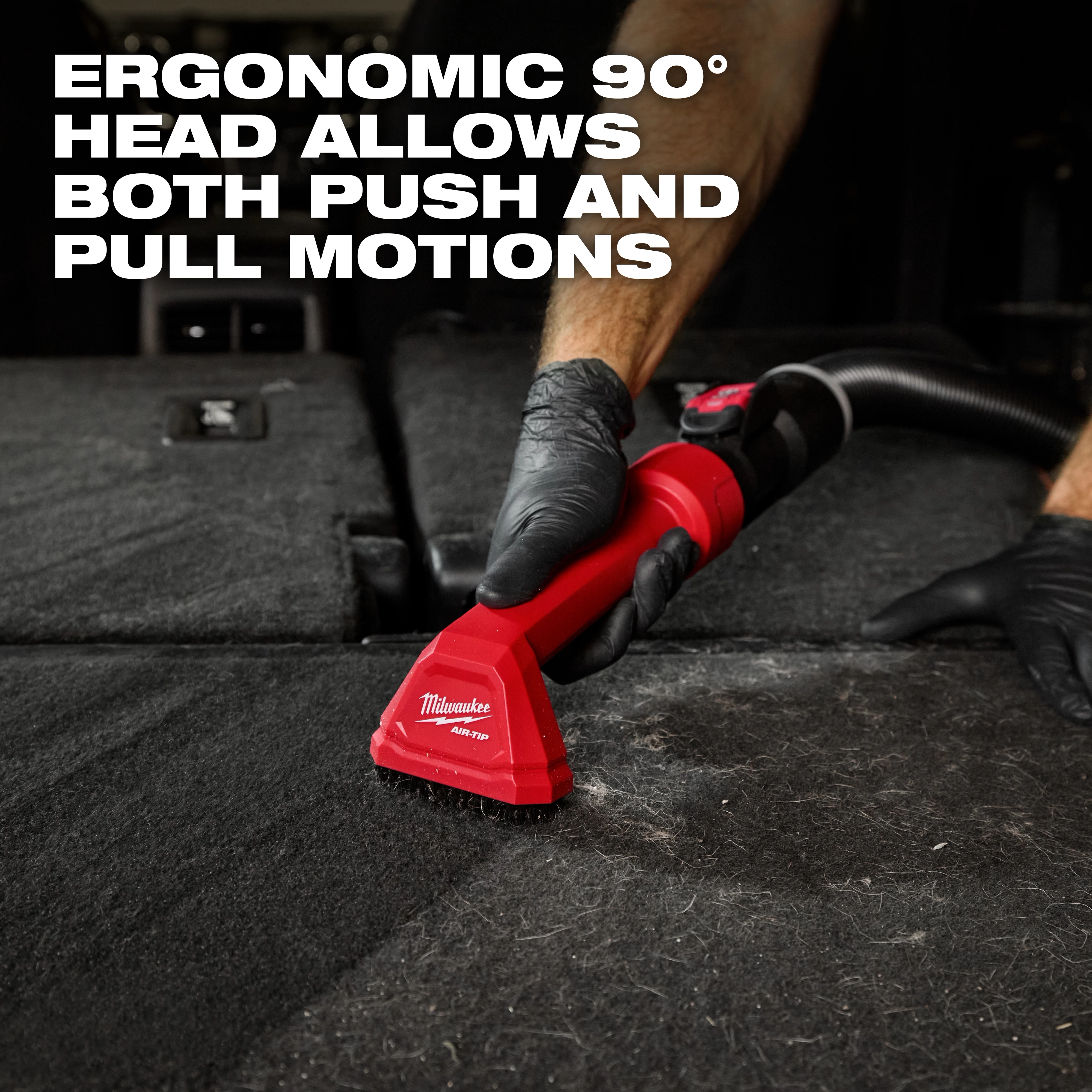 The AIR-TIP Automotive Detail Brush with an ergonomic 90° head is being used to clean a car's carpet in the image.