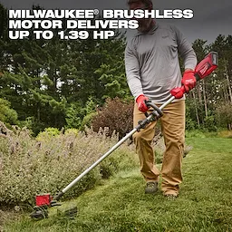 A person trims grass with the M18 Brushless String Trimmer, which has a powerful brushless motor delivering up to 1.39 horsepower. The trimmer features a red handle and is used in a well-maintained garden area surrounded by trees and shrubs.