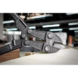Close-up of a 30" Bolt Cutter cutting a piece of wire, featuring its sharp jaws and sturdy black handles.
