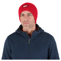 Image of a man wearing the Milwaukee Rib-Knit Cuffed Beanie in red