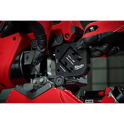 Close-up of hands installing a 7/8" & 1-5/8" x 1-5/8" Combination Strut Shearing Dies in a red power tool.