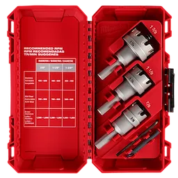 The image shows a One-Piece Carbide Hole Cutter Set: 4PC from Milwaukee, housed in a red plastic case. The set contains four carbide hole cutters of various sizes (7/8-inch, 1-1/8-inch, 1-3/8-inch, and another 7/8-inch) and additional pieces. The left side of the case displays a recommended RPM chart for different materials.