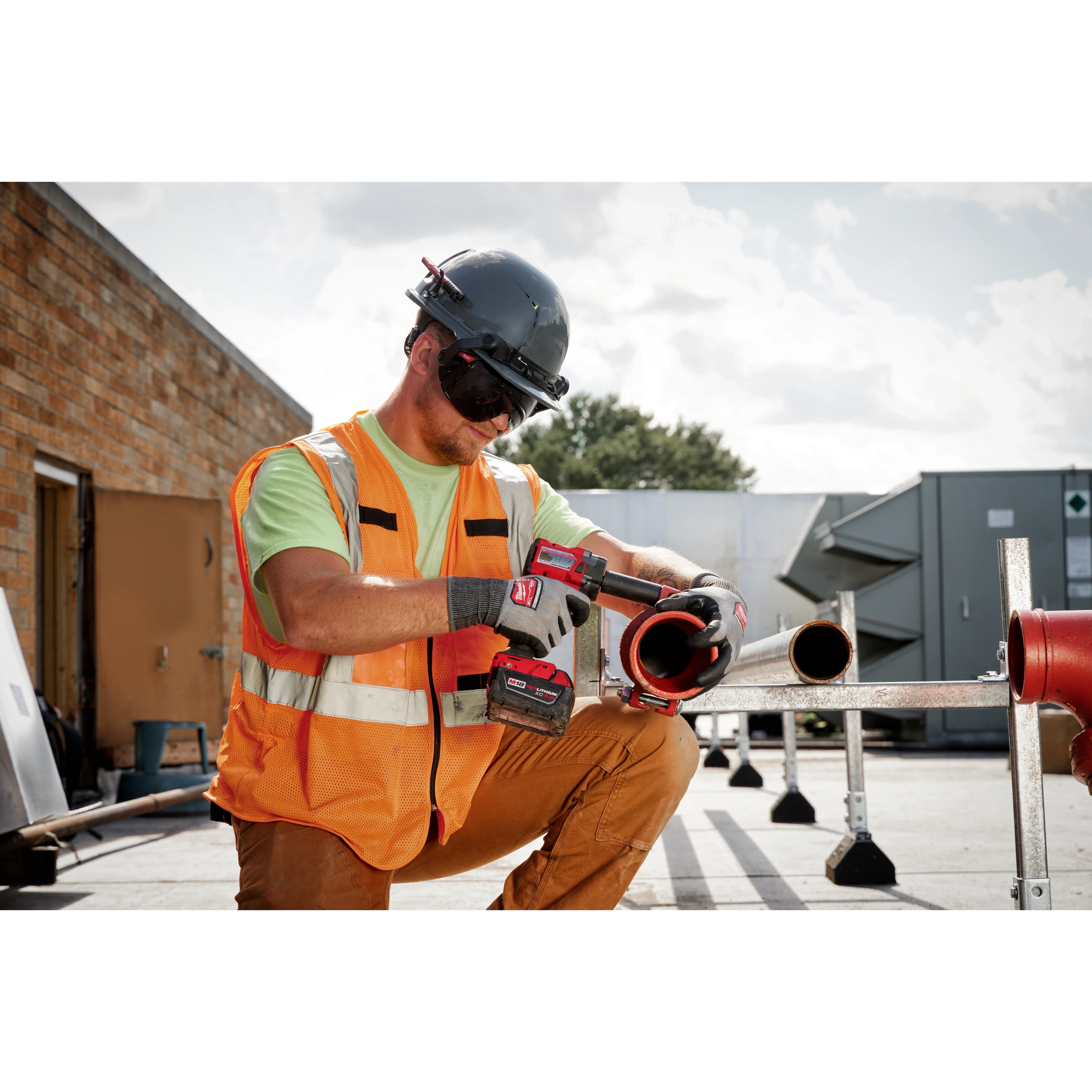 Worker wearing the BOLT Eye Visor Tinted Dual Coat Lens while drilling