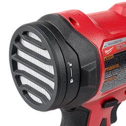 The M18™ Brushless Precision Blower has a red body with a black and white vented nozzle. The blower's handle is shown partially, along with a warning label.