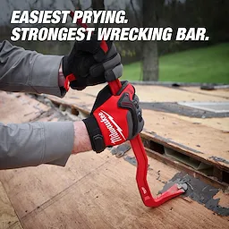 A person wearing red and black gloves uses an 18" Wrecking Bar to pry wood flooring. The red tool features a dual-purpose claw and angled design. The text on the image reads, "Easiest Prying. Strongest Wrecking Bar."