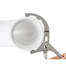 Comfort Grip PVC/Oil Filter Pliers gripping a white PVC pipe. The pliers feature a gray metallic finish and an adjustable, toothed grip designed for securing or turning objects. A hand is slightly visible, demonstrating use.