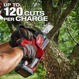 A person using the M12 FUEL™ HATCHET™ 6" Pruning Saw to cut a tree branch. The text on the image states "UP TO 120 CUTS PER CHARGE." The tool is red and black with sawdust visible as the cut is made.