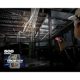 Person shines a REDLITHIUM USB Pivoting Flashlight in a construction area with hanging wires. Text reads "500 lumens" and "Trueview."
