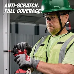 A construction worker wearing Wrap Around Safety Glasses - Clear Anti-Scratch Lenses operates a red power tool, promoting anti-scratch full coverage.