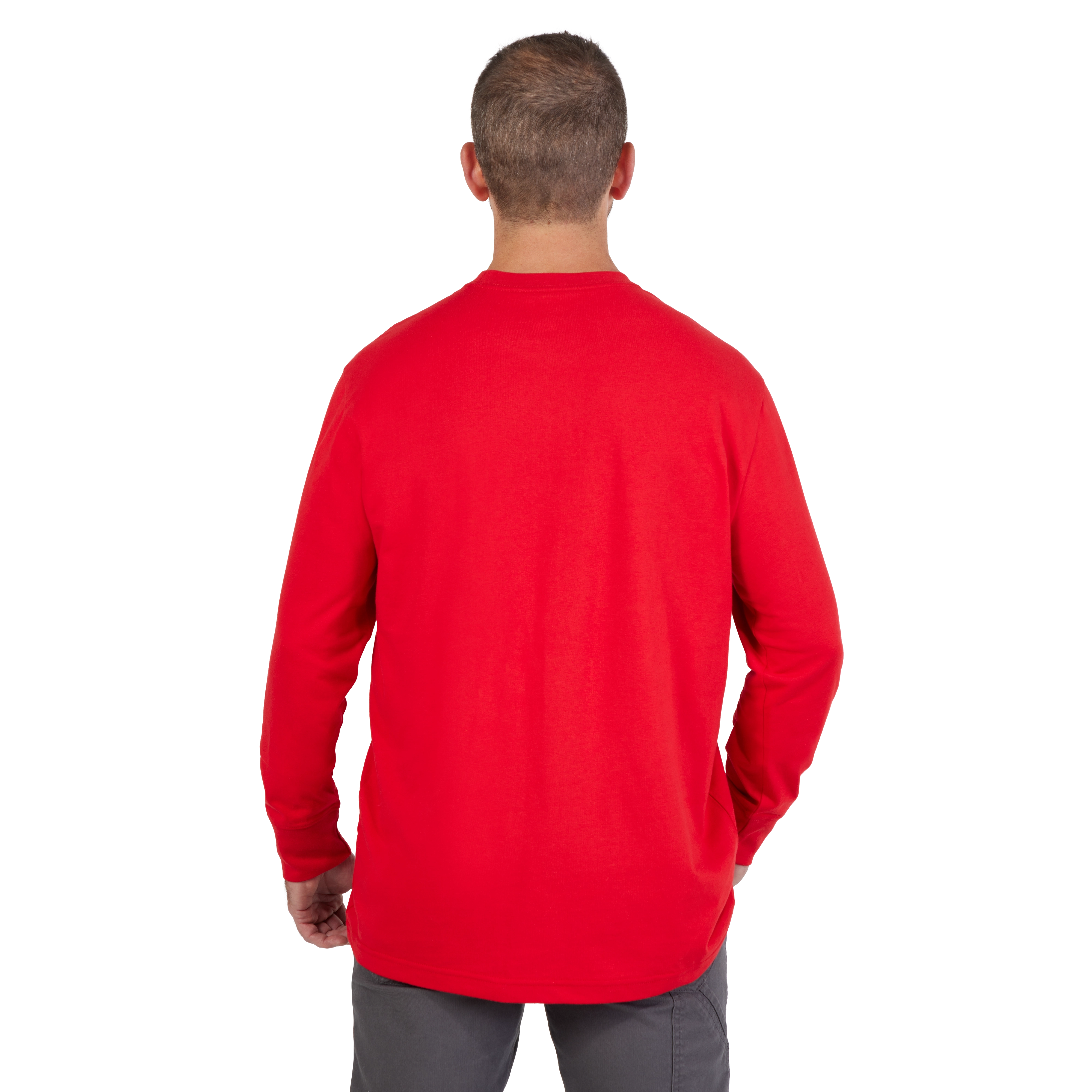 Man wearing a HEAVY DUTY T-SHIRT Long-Sleeve in Red, viewed from the back, with gray pants and a short haircut.