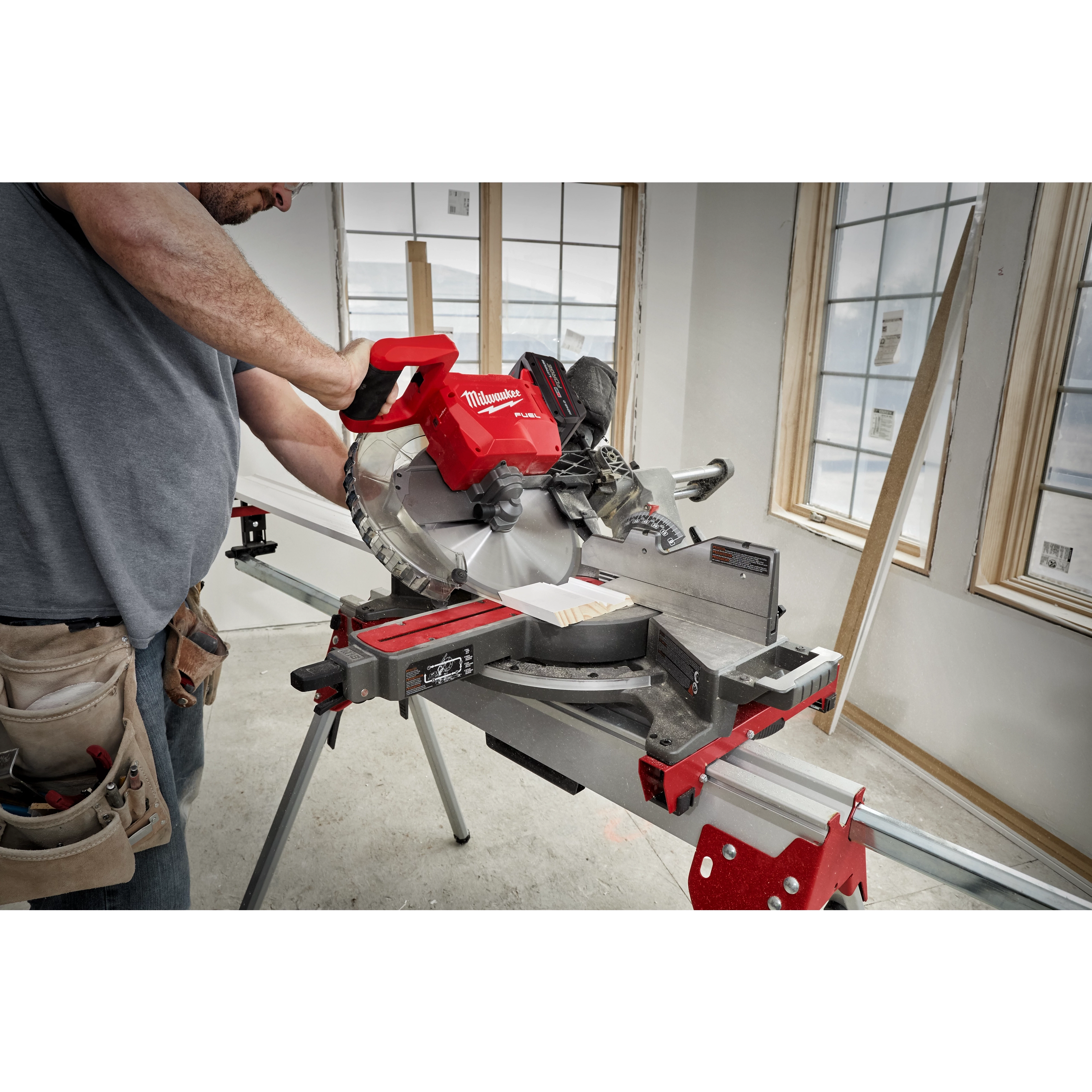 Image of the M18 FUEL™ 12” Dual Bevel Sliding Compound Miter Saw w/ ONE KEY™ being used on a jobsite