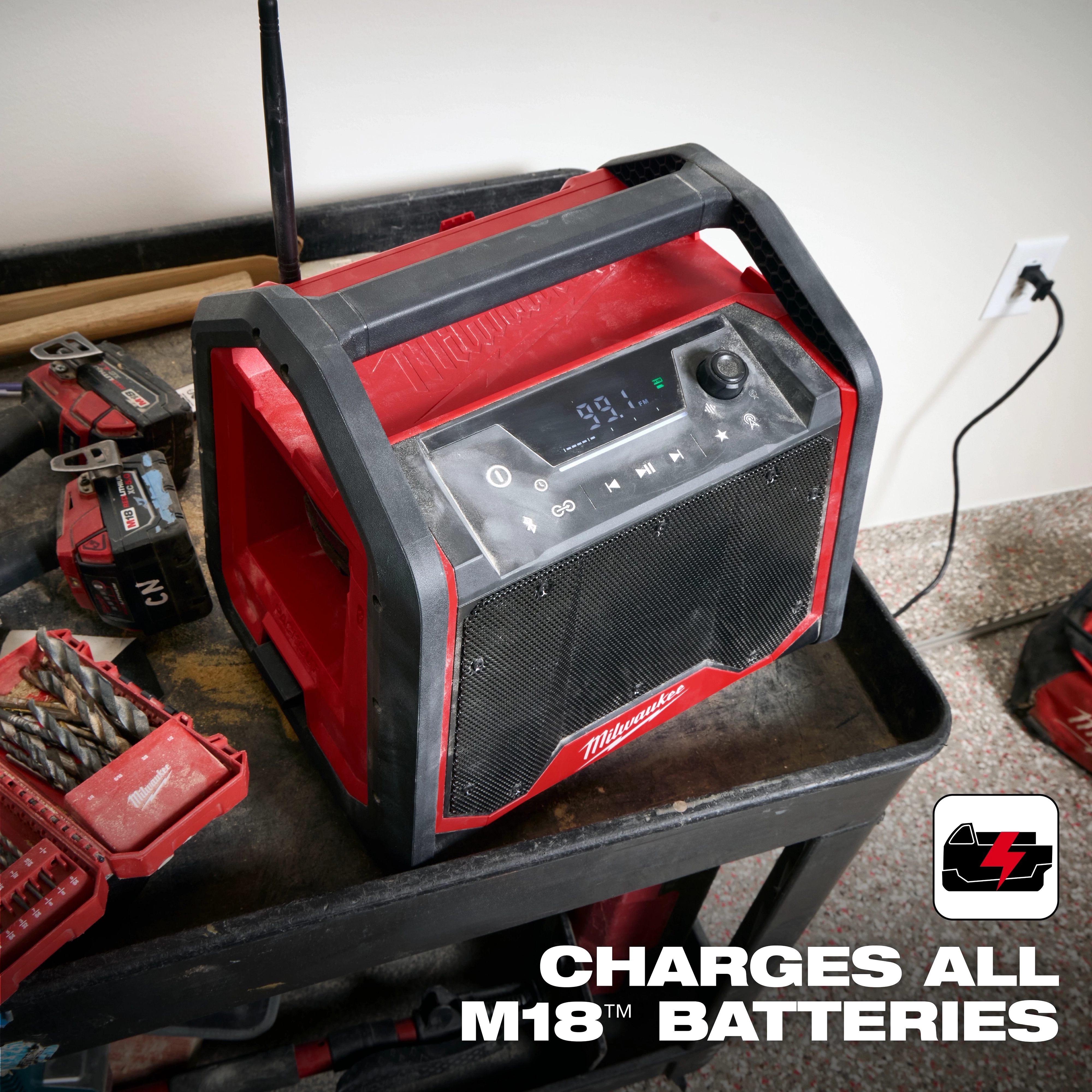 The M18 Bluetooth Jobsite Radio + Charger is a robust, red and black radio with a control panel and USB port. It charges M18 batteries.