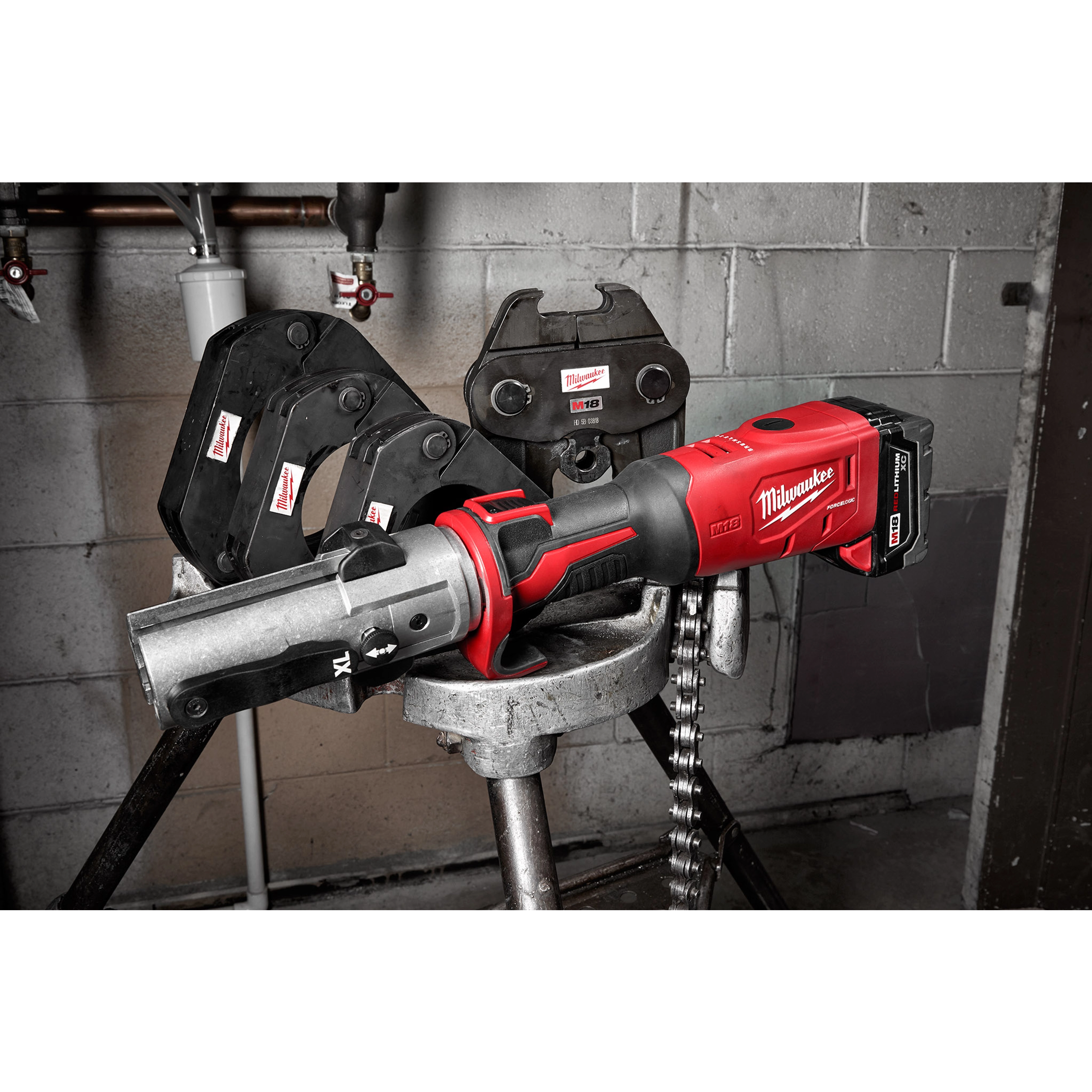 2½”- 4” IPS XL Ring Kit for M18 FORCE LOGIC Long Throw Press Tool displayed on a workbench with pressing attachments.