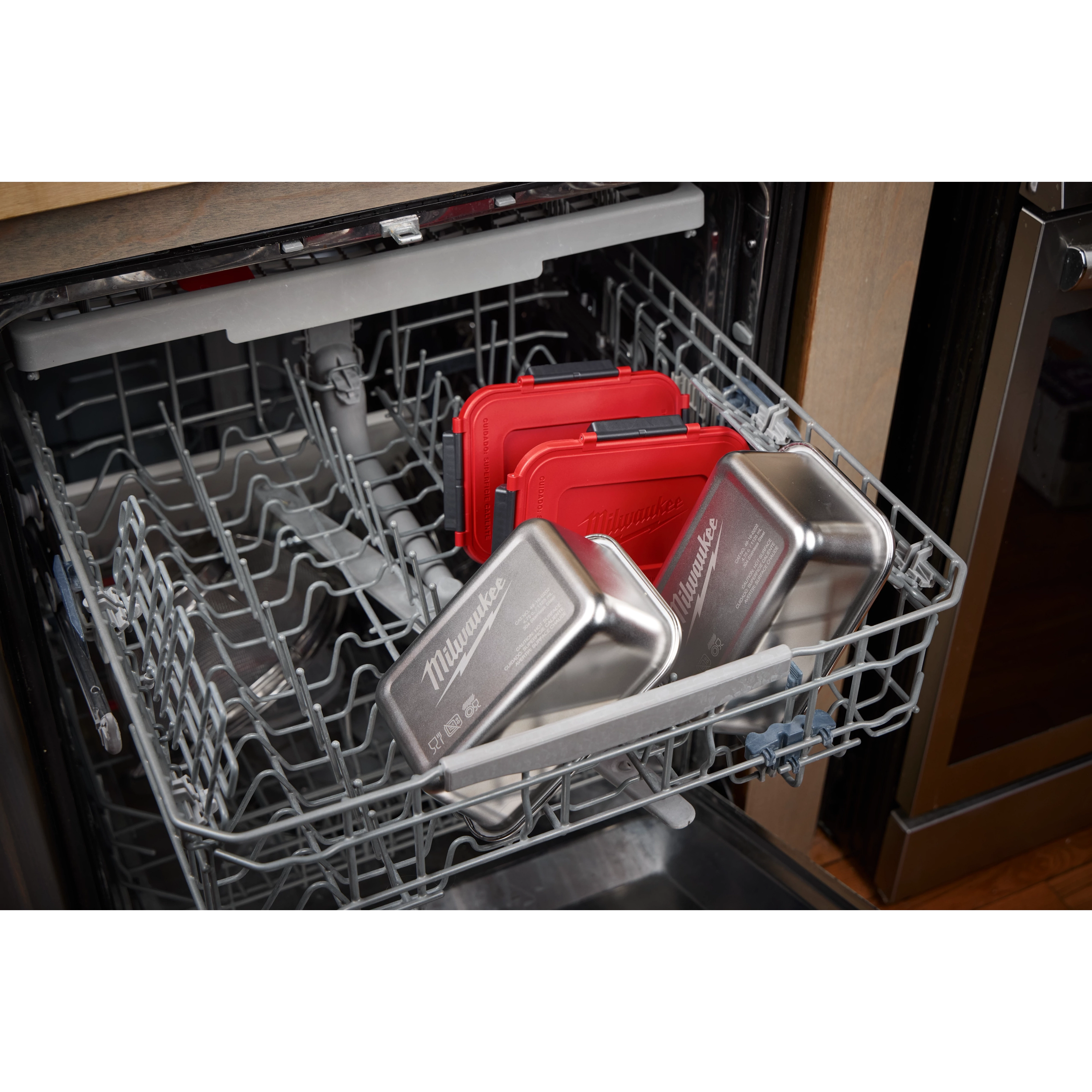 Stainless Steel Containers for M18 Jobsite Lunch Warmer placed on the lower rack of an open dishwasher.