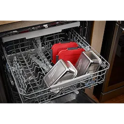 Stainless Steel Containers for M18 Jobsite Lunch Warmer placed on the lower rack of an open dishwasher.