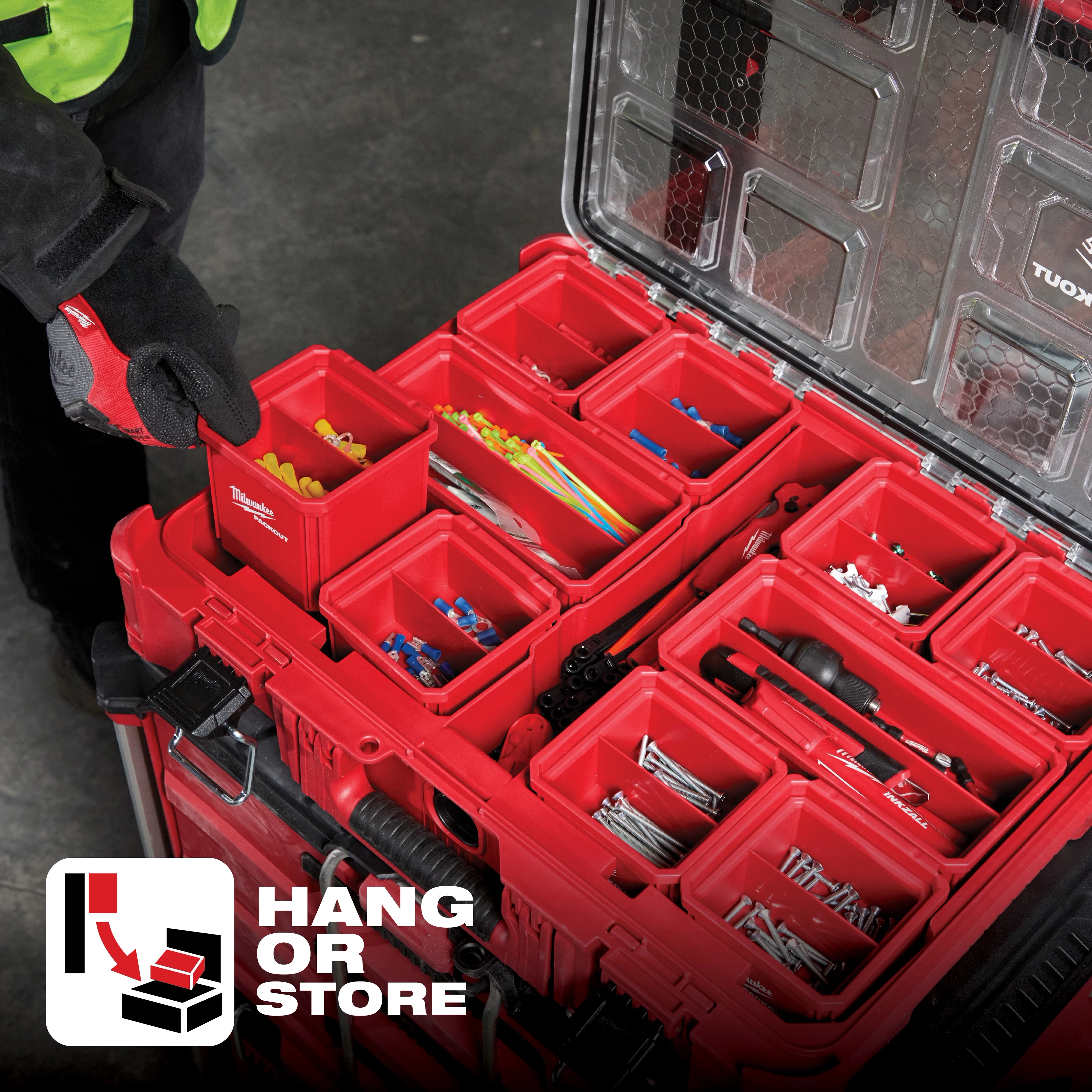 A tool storage system, App%20Shot%20Overlay, featuring multiple red compartments filled with various tools and accessories.