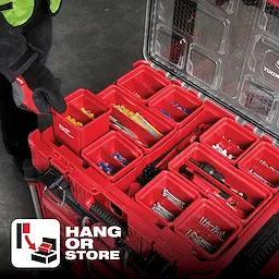 A tool storage system, App%20Shot%20Overlay, featuring multiple red compartments filled with various tools and accessories.