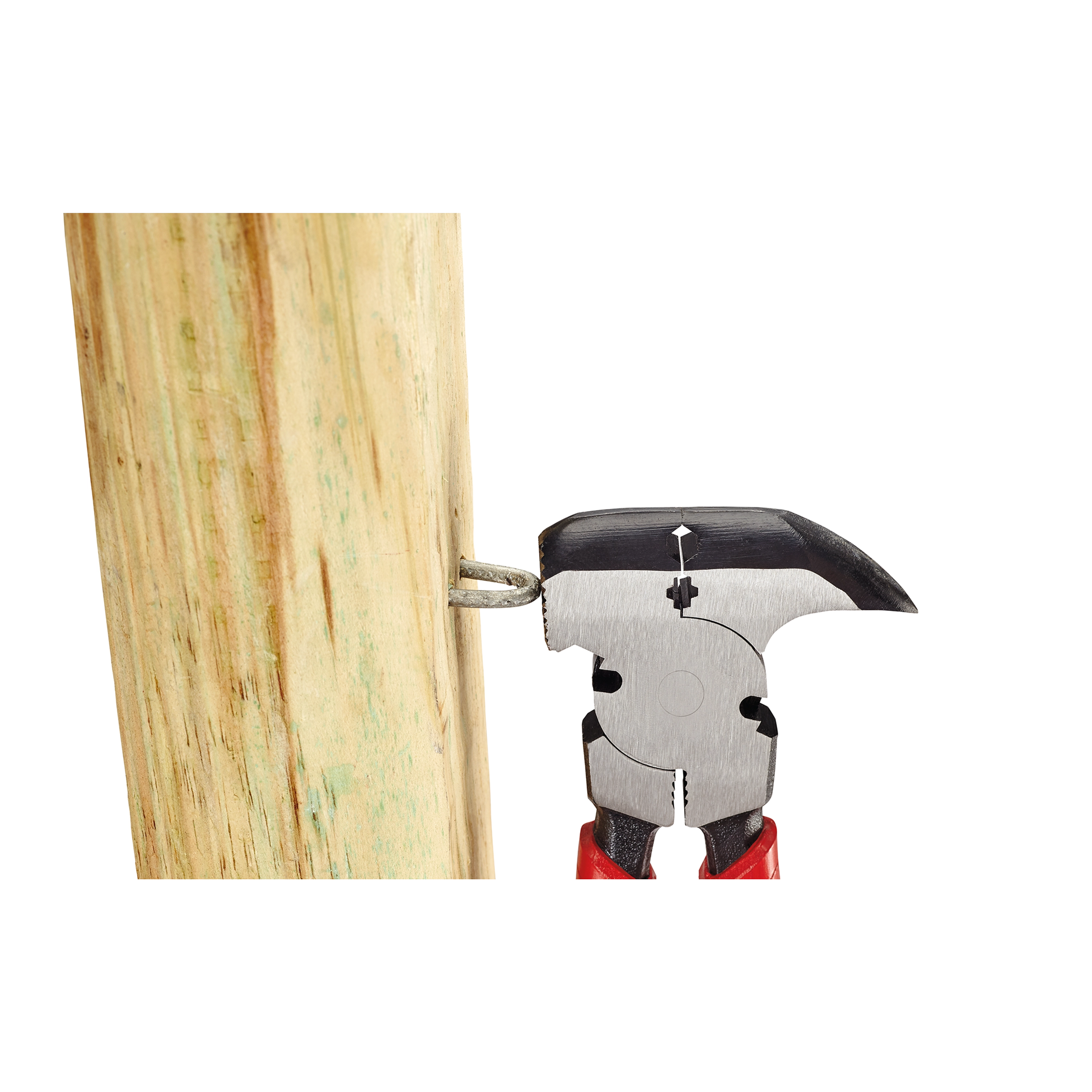 The Comfort Grip Fencing Pliers are gripping a nail embedded in a wooden post. The pliers have red handles and a metal head designed for pulling nails and cutting wire.