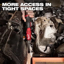 M12 FUEL 1/4" Extended Reach Ratchet being used between tightly packed engine components.