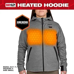 The M12™ Heated Hoodie, shown in size small on a 5'1" model, is made of gray fabric and features embedded Hexon heat technology. The hoodie has a zipper and pockets outlined in black and red details, and the Milwaukee logo on the chest.