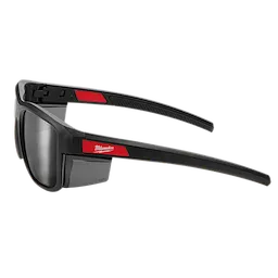 Full Frame Safety Glasses with Removable Side Shields feature silver mirrored anti-scratch lenses. The frame is black with red accents and includes logo branding on the arms. The side shields are detachable, providing versatility and additional protection for various working conditions.