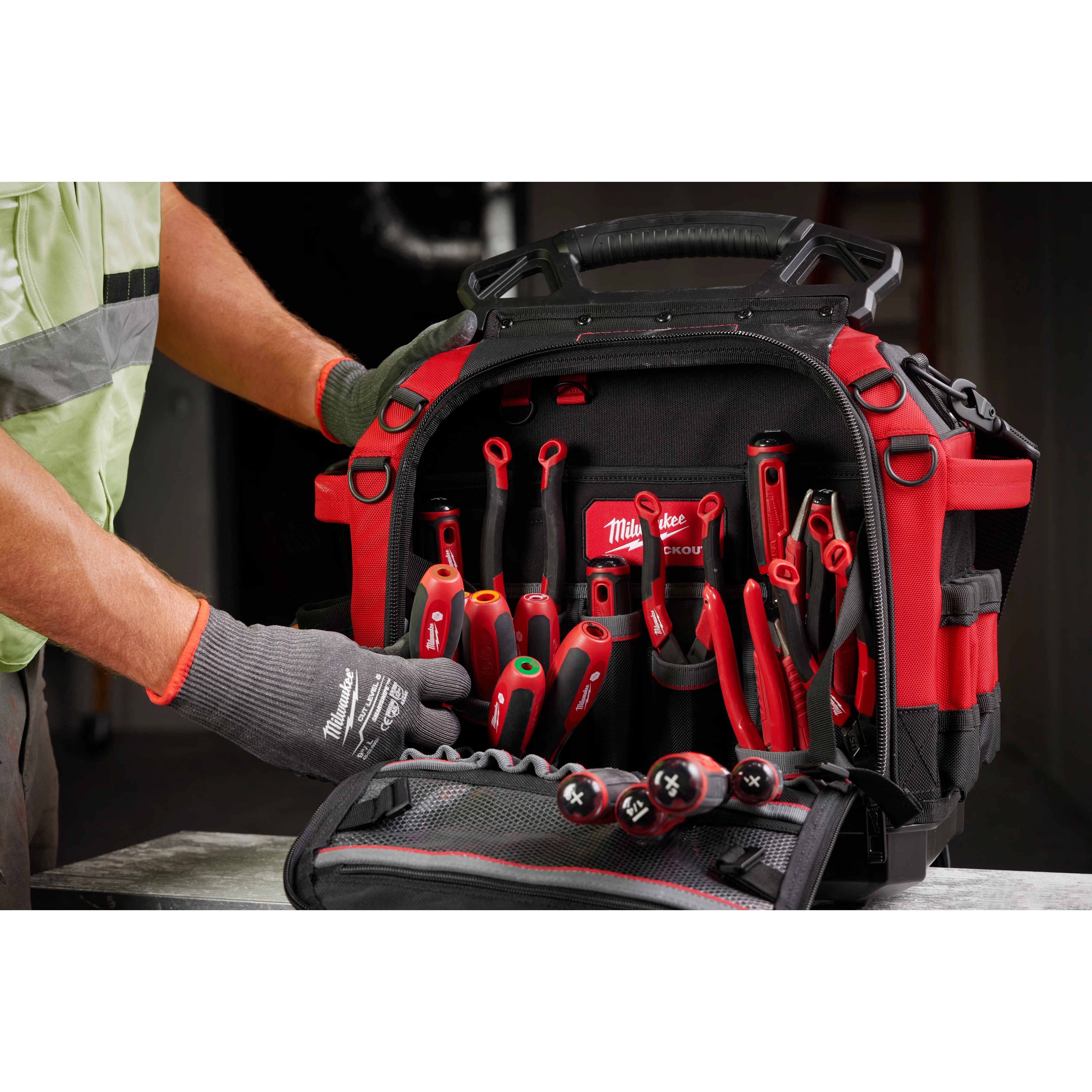 A person handles a set of tools inside a bag, featuring the 7pc SAE HollowCore Magnetic Nut Driver Set and 7pc SAE HollowCore Nut Driver Set.