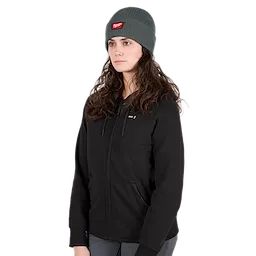 Image of a woman wearing the Milwaukee Rib-Knit Cuffed Beanie in green