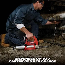 A man uses a red, heavy-duty grease gun to lubricate machinery. Text at the bottom states, "Dispenses up to 7 cartridges per charge."