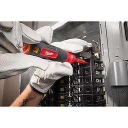 Person using the 2-in-1 1000V Insulated Flip Shank Multi-Bit Screwdriver to work on an electrical panel while wearing white gloves.