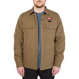 Man wearing the M12 Shirt Jacket in khaki color, with a blue undershirt.