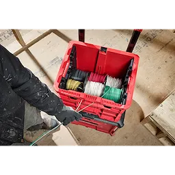 PACKOUT Wire Pulling XL Crate containing neatly organized spools of wire in various colors. A person is pulling wires from the crate.