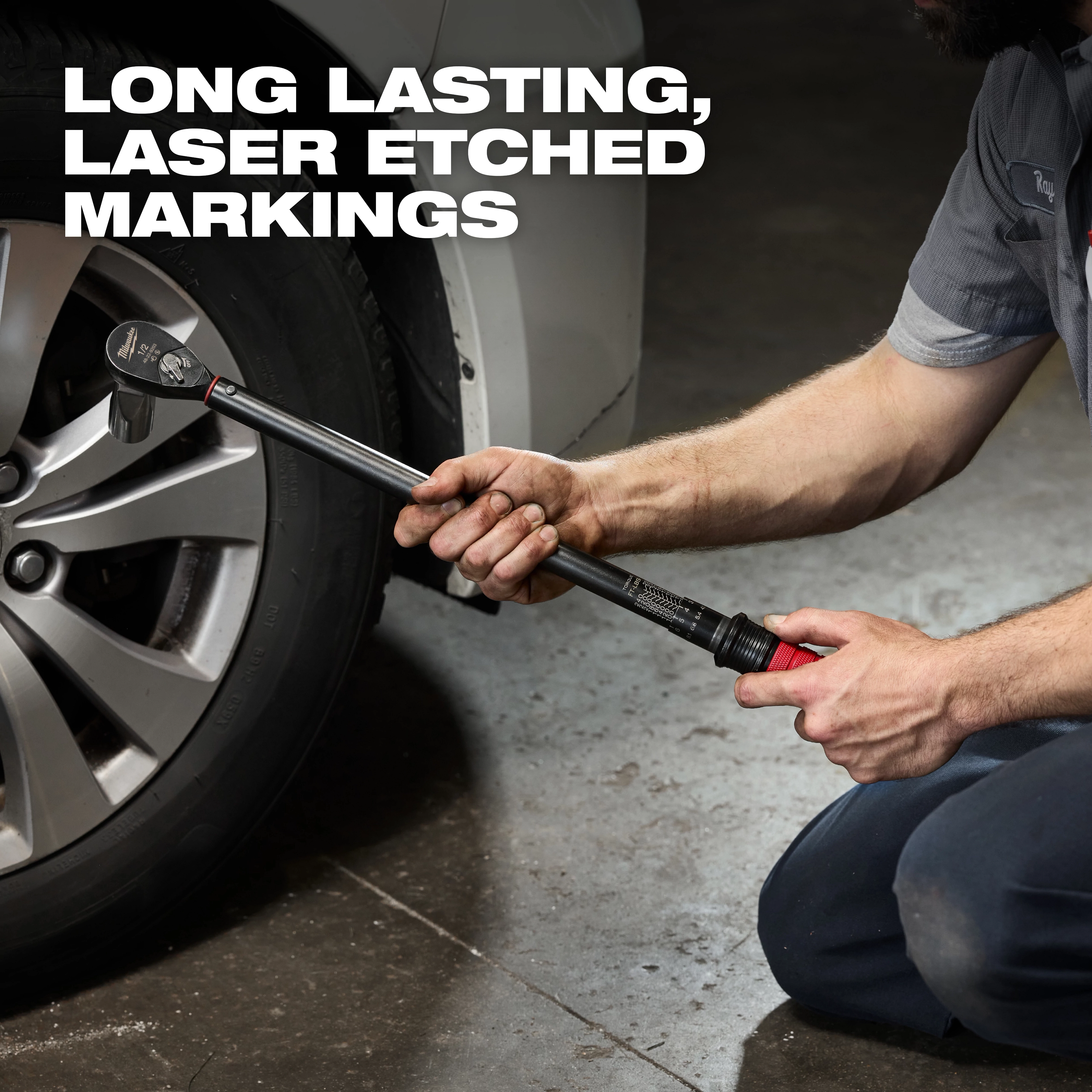 A person uses the 1/2" Drive Click Torque Wrench (50-250 ft·lbf) to tighten lug nuts on a car wheel, emphasizing its laser-etched markings.