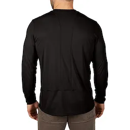 Back view of a man wearing the WORKSKIN Lightweight Performance Shirt in black, showing its long sleeves and stitching details.