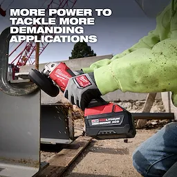 Worker grinds metal with a power tool using an M18 REDLITHIUM HIGH OUTPUT XC5 Battery Pack.