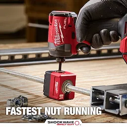 SHOCKWAVE Impact Duty 1/2" Threaded Rod Nut Runner tightening a nut on a threaded rod over a workbench.