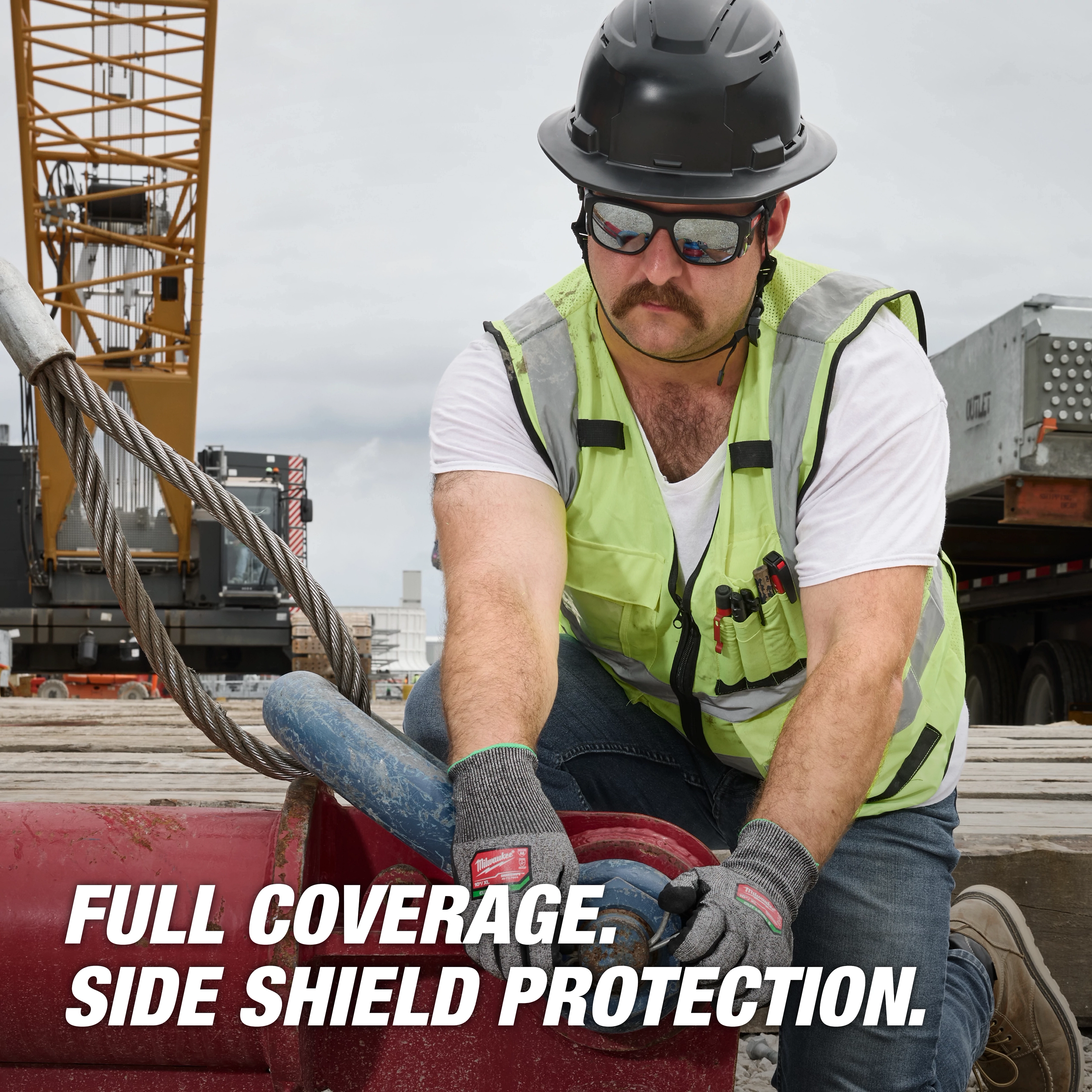 Construction worker wearing Full Frame Safety Glasses with Removable Side Shields, Silver Mirrored Anti-Scratch Lenses, gloves, and hard hat.