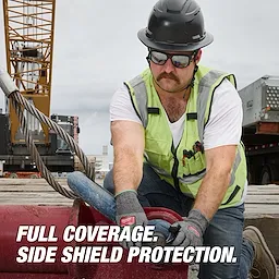 Construction worker wearing Full Frame Safety Glasses with Removable Side Shields, Silver Mirrored Anti-Scratch Lenses, gloves, and hard hat.