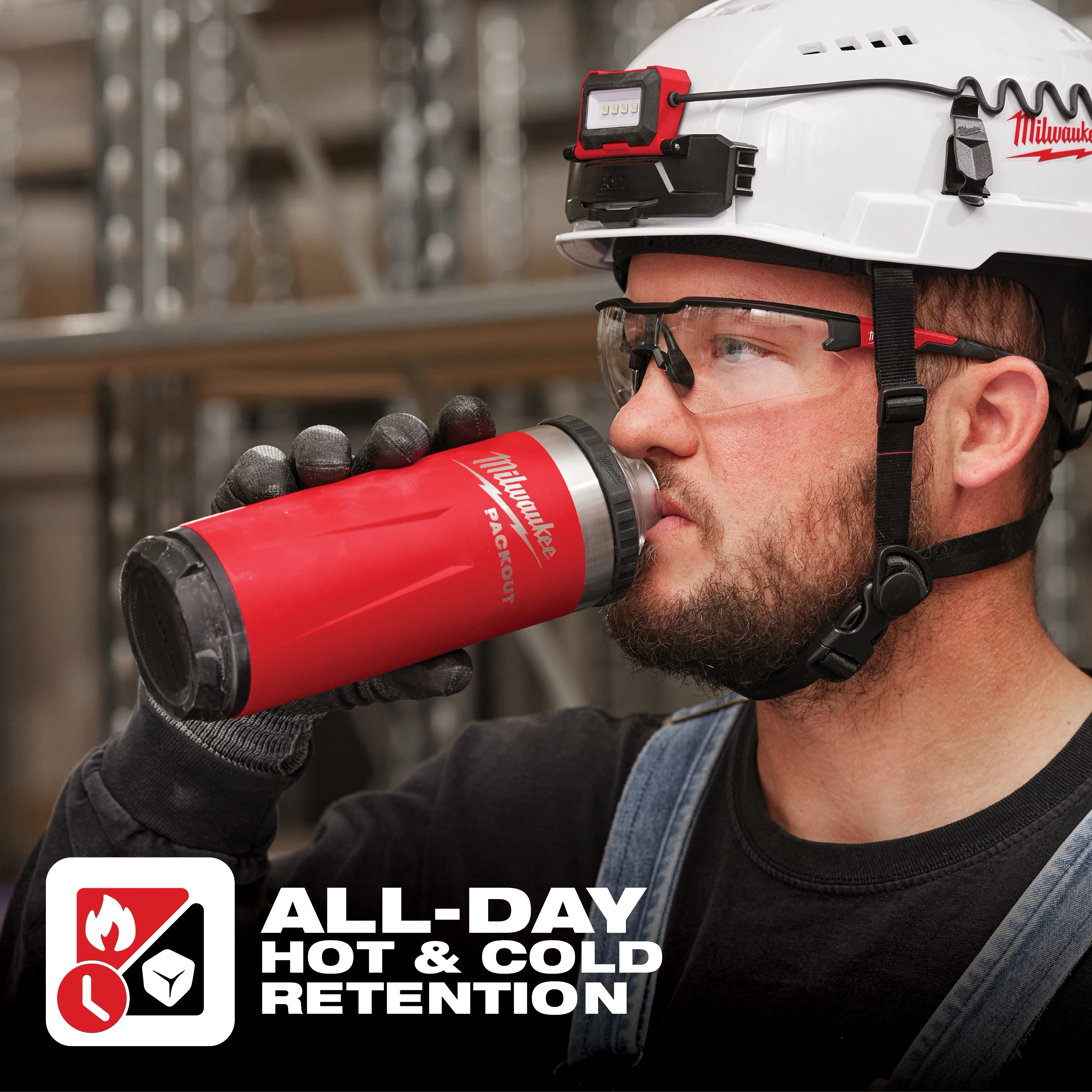 Worker holding a red App%20Shot%20Overlay thermal beverage container with "All-Day Hot & Cold Retention" text at the bottom.