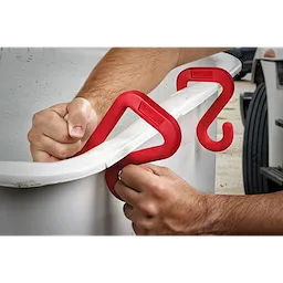 Red 2" Bucket Hook securely attached to the rim of a white bucket, with a person’s hands gripping and demonstrating its use.